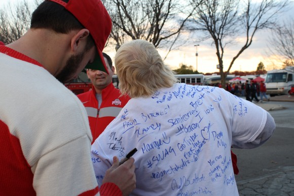 Titus signs @Bleez17's shirt.