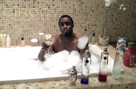 I think my favorite thing about this picture -- besides hotelesque tiling and way too many lotions for a man's shower -- is the jug of juice on Diddy's left. AND WHO IS TAKING THIS PICTURE??? (((***realize it's three naked girlz****)) ..... Touché, as always, Diddy. Touché.