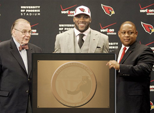 Beanie receives his award at the Cardinals Facility.