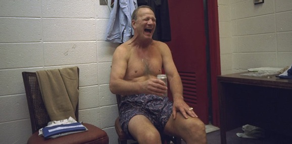 Barry Switzer enjoys a cold one in the locker room