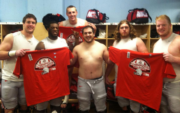 Reid Fragel, Marcus Hall, Corey Linsley, Andrew Norwell and Jack Mewhort celebrate in the locker room following Ohio State's 21-14 overtime win in Madison