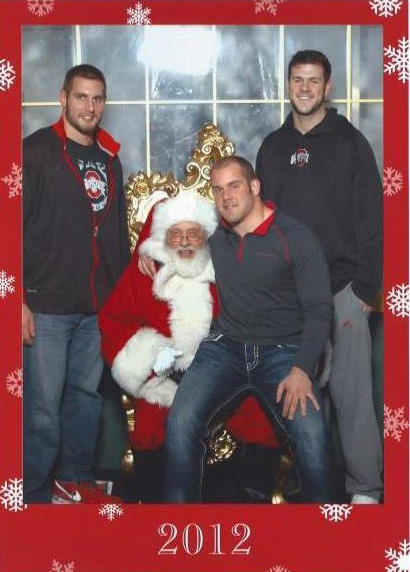 John Simon, Zach Boren and Jake Stoneburner pose with Santa