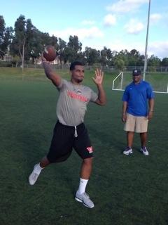 Braxton Miller throws in front of George Whitfield Jr.