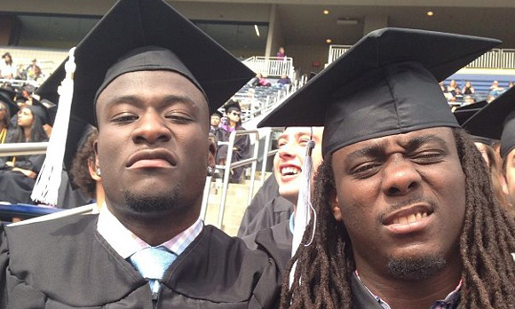 Devin Gardner and Denard Robinson at Michigan's graduation ceremonies.