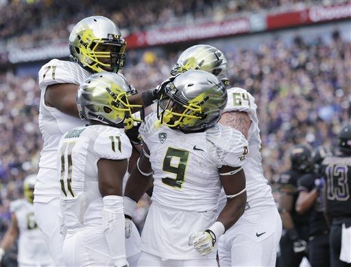 Oregon's Byron Marshall celebrates with teammates after scoring on a 15-yard run against Washington.