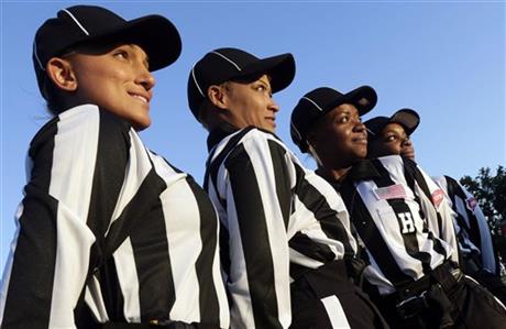 Women referees, from left, back judge Krystle Apellariz, field judge Sebrina Brunson, head linesman Yvonda Lewis and line judge Tangela Mitchell pose for a portrait prior to the start of an NCAA college football game between Lane College and Miles College in Fairfield, Ala., Thursday, Oct. 24, 2013. The Southern Intercollege Athletic Conference is billing it as the first majority-female officiating crew in an NCAA game. (AP Photo/Dave Martin)
