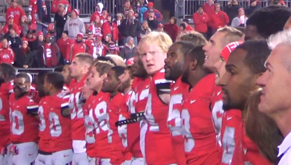 Ohio State football players sing Carmen Ohio following the 63-14 win over Penn State.