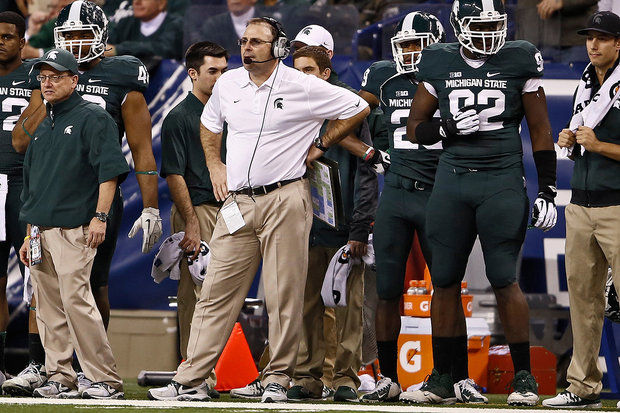Michigan State defensive coordinator Pat Narduzzi came down to the sideline in the third quarter, in an attempt to fire up the Spartans. (Mike Mulholland | MLive.com)
