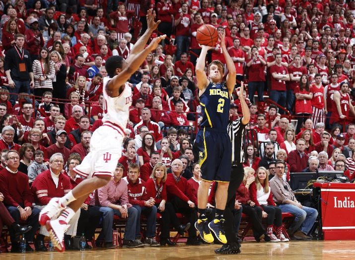 Spike Albrecht attempts to shoot over Yogi Ferrell.