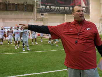 Bert Bielema leads an Arkansas practice.