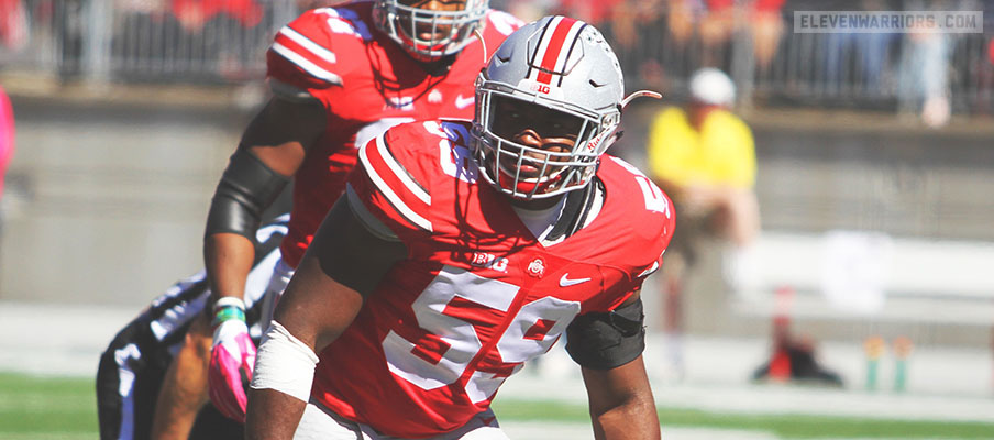 Tyquan Lewis lines up on the edge against Maryland