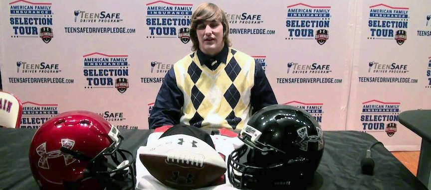 Joe Bolden receiving his Under Armour All-American jersey.