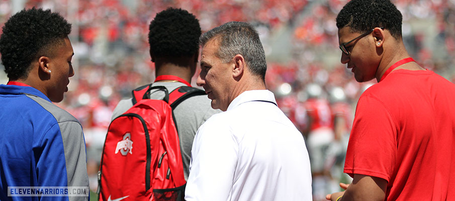 Kellen Mond, Urban Meyer and Leonard Taylor