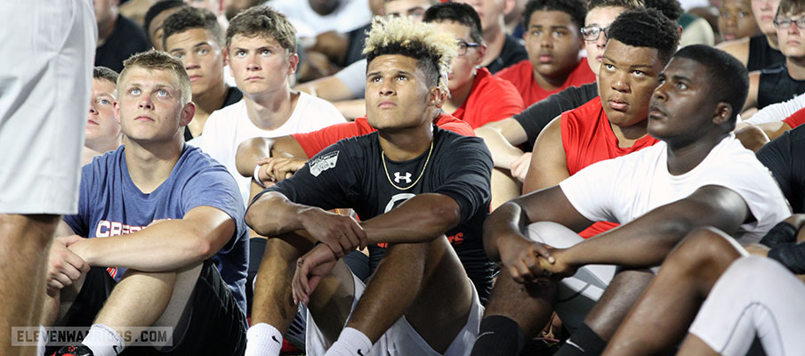 Dashon Bussell listens to Urban Meyer speak at Ohio State.