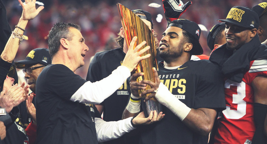 Urban Meyer lifts the championship trophy