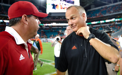 	Sep 10, 2016; Miami Gardens, FL, USA; Florida Atlantic Owls head coach Charlie Partridge (left) talks with Miami Hurricanes head coach Mark Richt (right) after their game at Hard Rock Stadium. Miami won 38-10. Mandatory Credit: Steve Mitchell-USA TODAY Sports