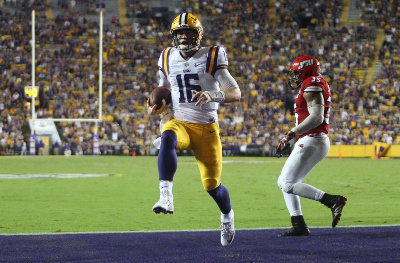 Sep 10, 2016; Baton Rouge, LA, USA; LSU Tigers quarterback Danny Etling (16) runs the ball into the end zone for a touchdown in front of Jacksonville State Gamecocks linebacker Quan Stoudemire (35) during the second half at Tiger Stadium. LSU defeated Jacksonville State 34-13. Mandatory Credit: Crystal LoGiudice-USA TODAY Sports Sep 10, 2016; Baton Rouge, LA, USA; LSU Tigers quarterback Danny Etling (16) runs the ball into the end zone for a touchdown in front of Jacksonville State Gamecocks linebacker Quan Stoudemire (35) during the second half at Tiger Stadium. LSU defeated Jacksonville State 34-13. Mandatory Credit: Crystal LoGiudice-USA TODAY Sports