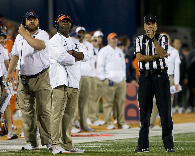 Sep 10, 2016; Champaign, IL, USA; (left to right) Illinois Fighting Illini offensive line coach Luke Butkus, head coach Lovie Smith, and back judge Jim Biddle watch the replay board during the 4th quarter at Memorial Stadium. North Carolina beat Illinois 48 to 23. Mandatory Credit: Mike Granse-USA TODAY Sports