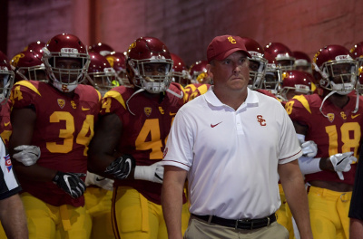 Sep 10, 2016; Los Angeles, CA, USA; USC Trojans head coach Clay Helton leads players onto the field during a NCAA football game against the Utah State Aggies at Los Angeles Memorial Coliseum. Mandatory Credit: Kirby Lee-USA TODAY Sports