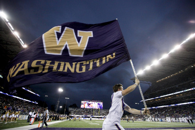 Sep 17, 2016; Seattle, WA, USA; A Washington Huskies cheerleader runs on the field after a touchdown against the Portland State Vikings during the fourth quarter at Husky Stadium. Washington won 41-3. Mandatory Credit: Jennifer Buchanan-USA TODAY Sports