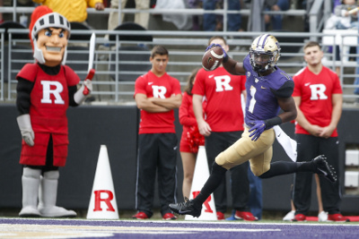 Sep 3, 2016; Seattle, WA, USA; Washington Huskies wide receiver John Ross (1) skips into the end zone in front of the Rutgers Scarlet Knights cheerleaders after scoring on a 50-yard touchdown catch in the first quarter at Husky Stadium. Mandatory Credit: Jennifer Buchanan-USA TODAY Sports