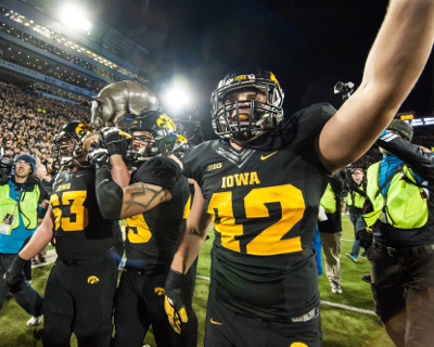 Nov 14, 2015; Iowa City, IA, USA; The Iowa Hawkeyes grasp the Floyd of Rosedale trophy after the game against the Minnesota Golden Gophers at Kinnick Stadium. Iowa won 40-35. Mandatory Credit: Jeffrey Becker-USA TODAY Sports Nov 14, 2015; Iowa City, IA, USA; The Iowa Hawkeyes grasp the Floyd of Rosedale trophy after the game against the Minnesota Golden Gophers at Kinnick Stadium. Iowa won 40-35. Mandatory Credit: Jeffrey Becker-USA TODAY Sports