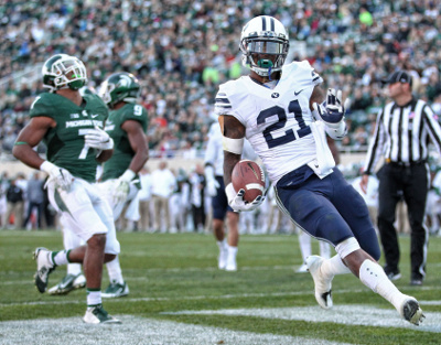 Oct 8, 2016; East Lansing, MI, USA; Brigham Young Cougars running back Jamaal Williams (21) runs the ball for a touchdown during the second half of a game against the Michigan State Spartans at Spartan Stadium. Mandatory Credit: Mike Carter-USA TODAY Sports