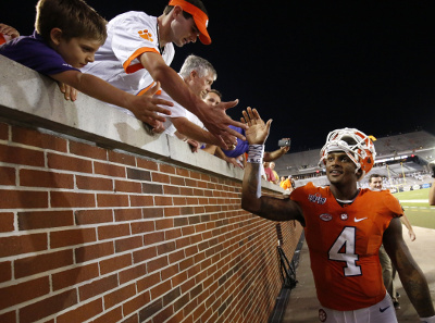 	Sep 22, 2016; Atlanta, GA, USA; Clemson Tigers quarterback Deshaun Watson (4) celebrates with fans after their game against the Georgia Tech Yellow Jackets at Bobby Dodd Stadium. The Tigers won 26-7. Mandatory Credit: Jason Getz-USA TODAY Sports