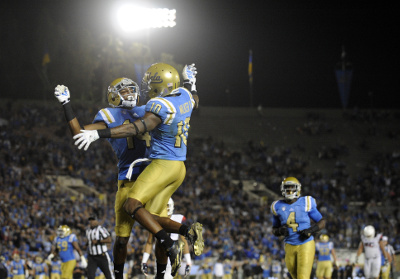 October 1, 2016; Pasadena, CA, USA; UCLA Bruins wide receiver Kenneth Walker III (10) celebrates with wide receiver Theo Howard (14) his touchdown scored against the Arizona Wildcats during the second half at Rose Bowl. Mandatory Credit: Gary A. Vasquez-USA TODAY Sports