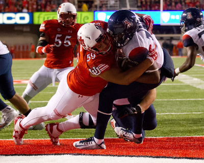 Oct 8, 2016; Salt Lake City, UT, USA; Utah Utes defensive tackle Pasoni Tasini (59) tackles Arizona Wildcats quarterback Khalil Tate (14) for a safety during the first half at Rice-Eccles Stadium. Utah won 36-23. Mandatory Credit: Russ Isabella-USA TODAY Sports