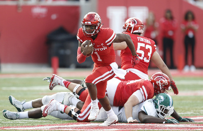 	Nov 12, 2016; Houston, TX, USA; Houston Cougars quarterback Greg Ward Jr. (1) rushes against the Tulane Green Wave in the second quarter at TDECU Stadium. Mandatory Credit: Thomas B. Shea-USA TODAY Sports