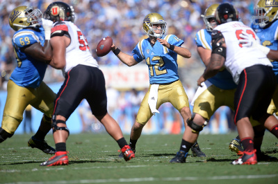 October 22, 2016; Pasadena, CA, USA; UCLA Bruins quarterback Mike Fafaul (12) throws against the Utah Utes during the first half at the Rose Bowl. Mandatory Credit: Gary A. Vasquez-USA TODAY Sports