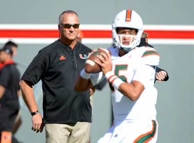 Nov 19, 2016; Raleigh, NC, USA; Miami Hurricanes head coach Mark Richt (L) watches quarterback Brad Kaaya (15) warm up prior to the game against the North Carolina State Wolfpack at Carter Finley Stadium. Mandatory Credit: Rob Kinnan-USA TODAY Sports