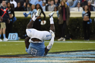 Nov 19, 2016; Chapel Hill, NC, USA; North Carolina Tar Heels running back T.J. Logan (8) in the end zone after making a one handed touchdown catch in the second quarter at Kenan Memorial Stadium. Mandatory Credit: Bob Donnan-USA TODAY Sports
