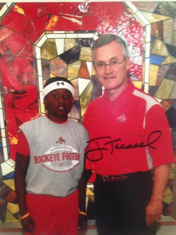 A young Dwayne Haskins with Jim Tressel.