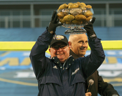 Dec 22, 2015; Boise, ID, USA; Akron Zips head coach Terry Bowden holds The Famous Idaho Potato Bowl trophy at Bronco Stadium. Akron defeated Utah State 23-21. Mandatory Credit: Brian Losness-USA TODAY Sports