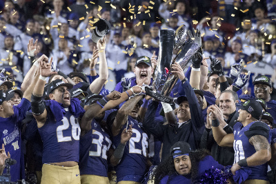 December 2, 2016; Santa Clara, CA, USA; Washington Huskies head coach Chris Petersen hoists the championship trophy after the Pac-12 championship against the Colorado Buffaloes at Levi's Stadium. The Huskies defeated the Buffaloes 41-10. Mandatory Credit: Kyle Terada-USA TODAY Sports