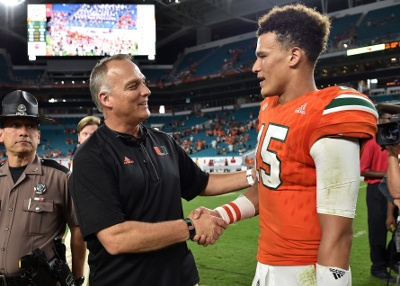 Nov 26, 2016; Miami Gardens, FL, USA; Miami Hurricanes head coach Mark Richt (left) shakes hands with Miami Hurricanes quarterback Brad Kaaya (right) after defeating the Duke Blue Devils 40-21 at Hard Rock Stadium. Mandatory Credit: Steve Mitchell-USA TODAY Sports