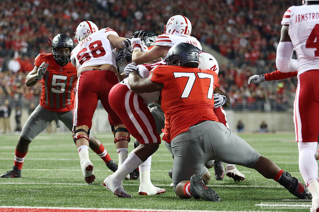 Ohio State defensive tackle Michael Hill makes a tackle vs. Nebraska.