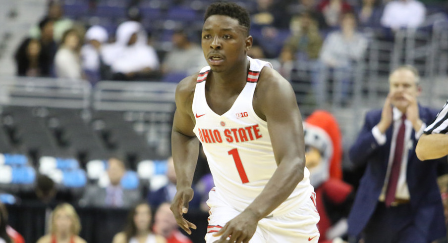 Ohio State's Jae'Sean Tate dribbles up the floor.