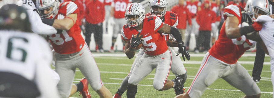 Rare photo of Ezekiel Elliott touching the football against Michigan State on November 21, 2015.