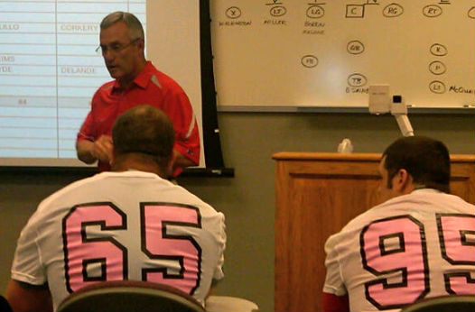Tressel administers the Spring Game Draft as Justin Boren (wearing pink-themed jersey) helps Gray select