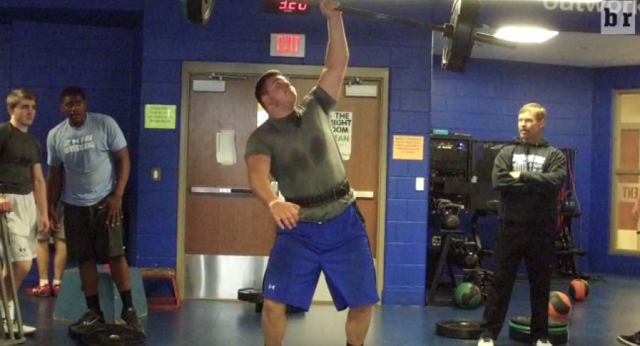 Joshua Myers Power Snatches 155 pounds with one hand.