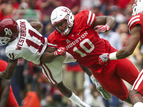 Sep 3, 2016; Houston, TX, USA; Houston Cougars defensive tackle Ed Oliver (10) attempts to make a tackle on Oklahoma Sooners wide receiver Dede Westbrook (11) during the game at NRG Stadium. Mandatory Credit: Troy Taormina-USA TODAY Sports