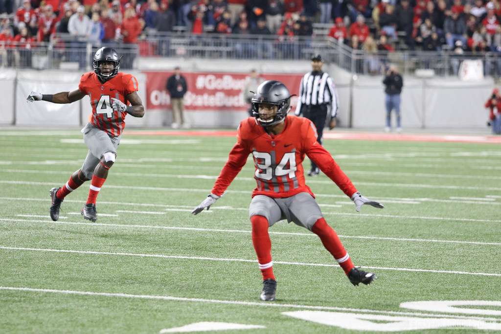 Jordan Fuller (4) and Erick Smith (34)