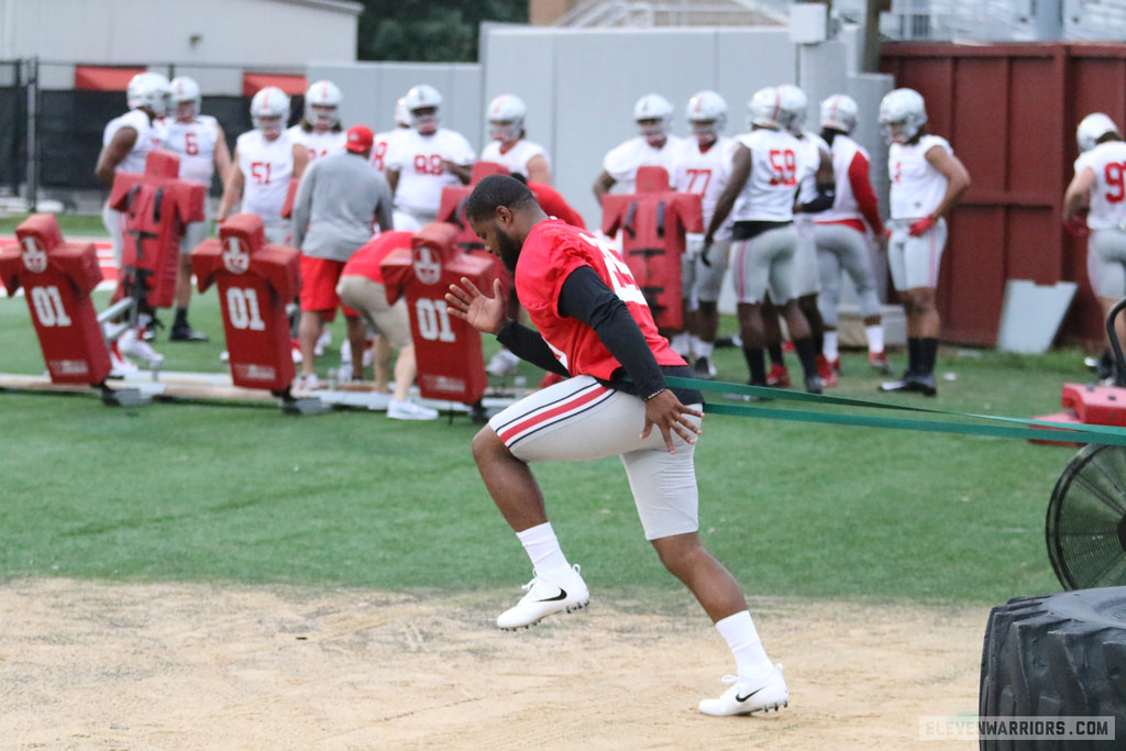 Mike Weber working out with an athletic trainer during the first practice of fall camp.