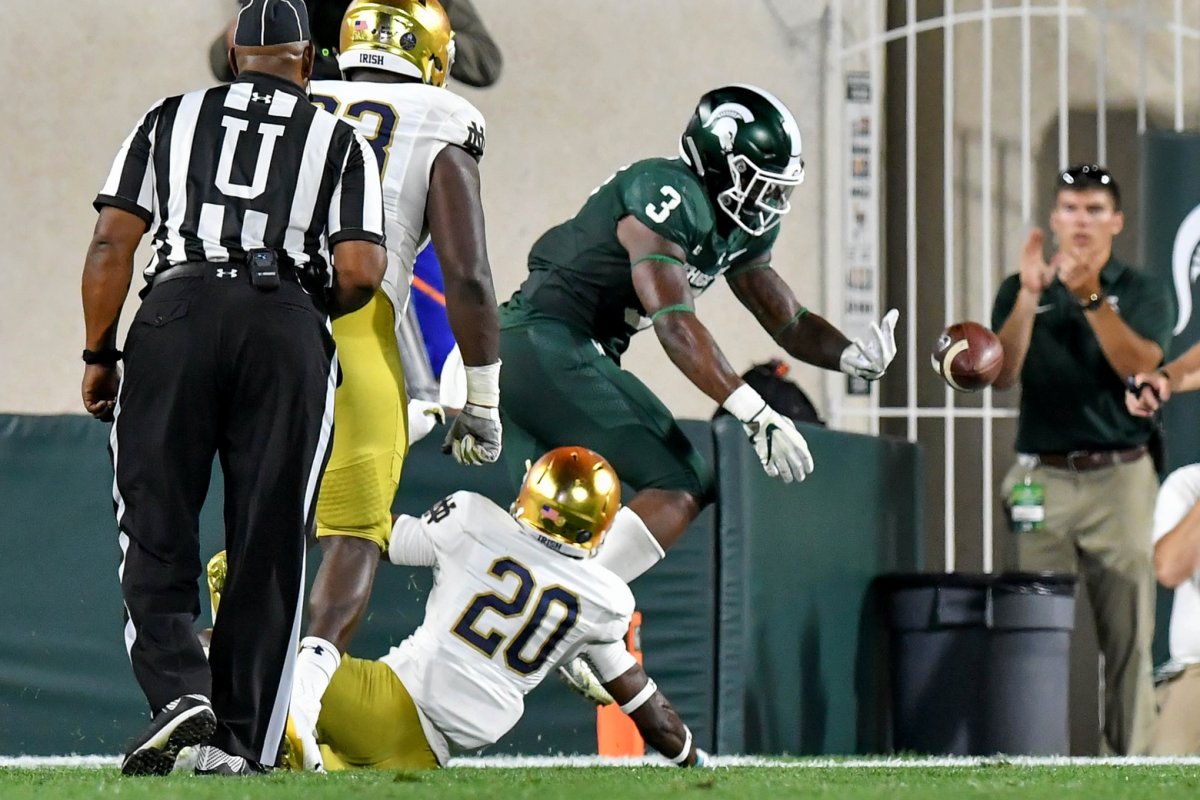 Sep 23, 2017; East Lansing, MI, USA; Michigan State Spartans tailback L.J. Scott (3) drops the ball in the end zone as Notre Dame Fighting Irish cornerback Shaun Crawford (20) defends in the second quarter at Spartan Stadium. Mandatory Credit: Matt Cashore-USA TODAY Sports