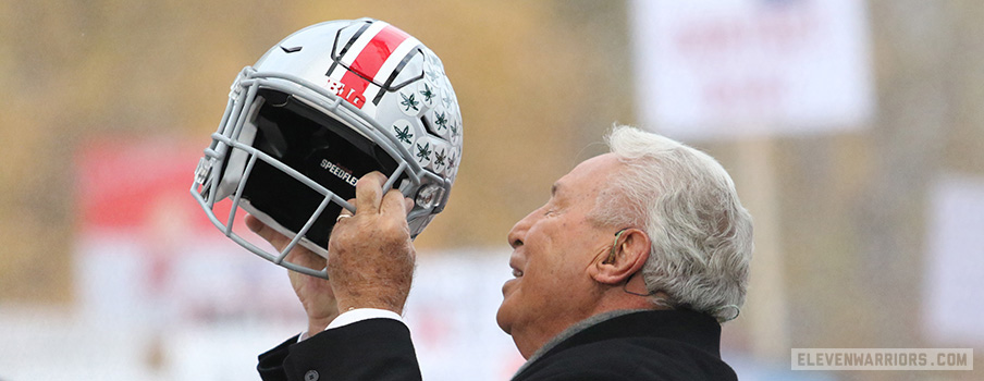 Lee Corso holds an Ohio State helmet up on the College GameDay set in 2016.