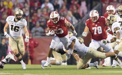 Oct 14, 2017; Madison, WI, USA; Wisconsin Badgers running back Jonathan Taylor (23) rushes with the football during the fourth quarter against the Purdue Boilermakers at Camp Randall Stadium. Mandatory Credit: Jeff Hanisch-USA TODAY Sports