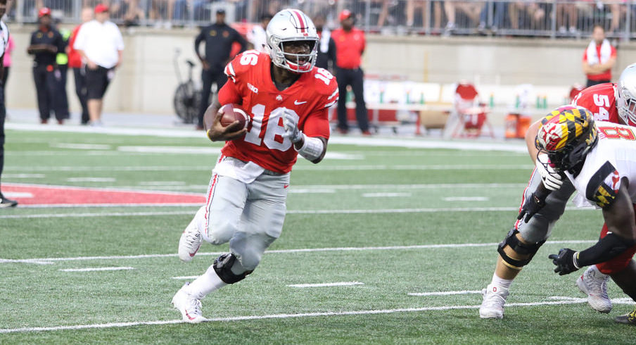 Quarterback J.T. Barrett set multiple career highs in 2017 under first-year quarterbacks coach Ryan Day.